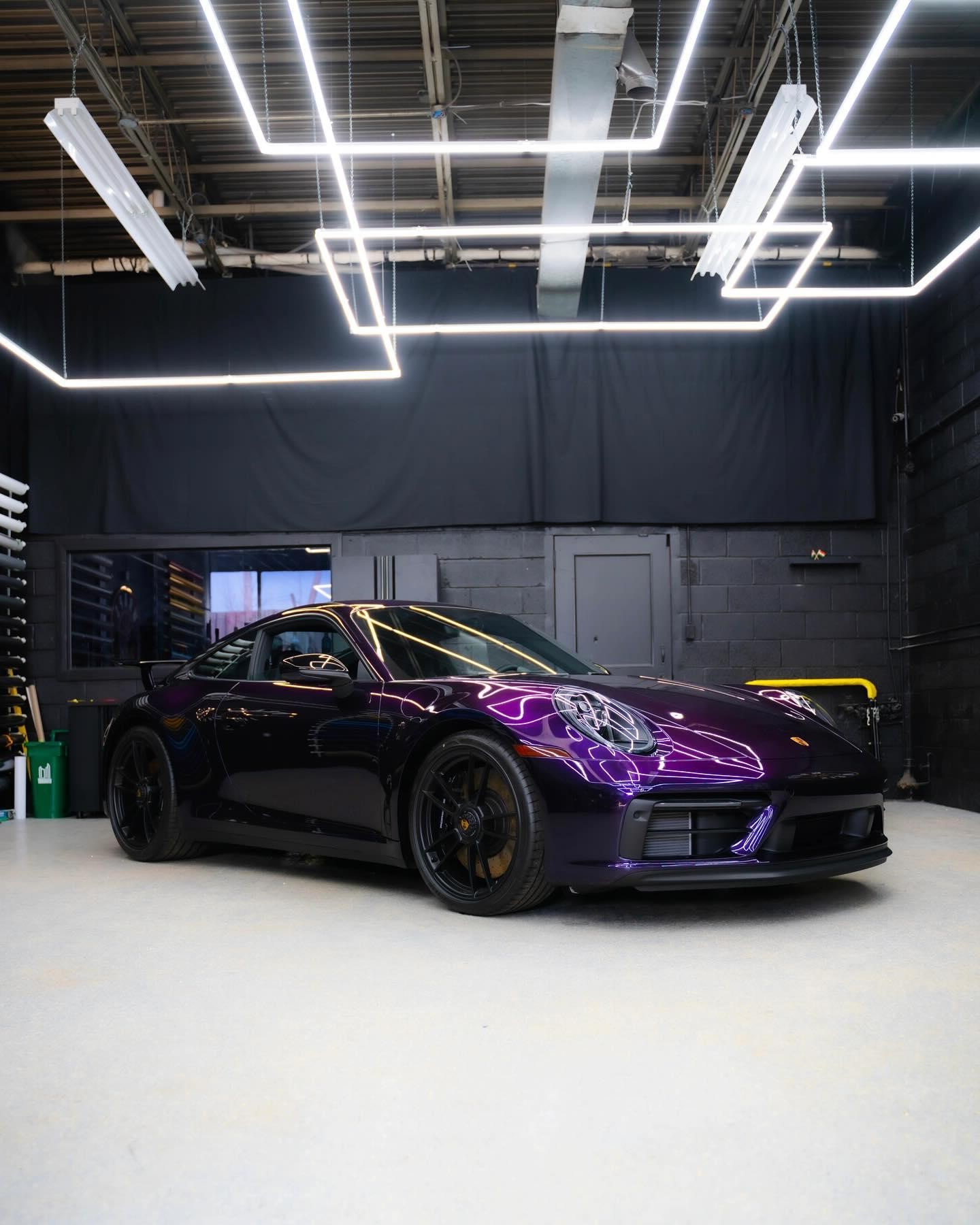 Purple Porsche 911 wrap in the bay at AXIS WRAPS
